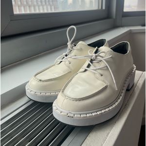 White Reformation loafers